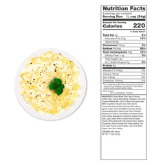 Plate of creamy pasta Alfredo garnished with parsley and cheese, next to nutrition facts label