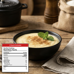 Vanilla pudding served in a black bowl on a rustic wooden table, topped with a sprinkle of cinnamon and a mint leaf. A nutrition facts label overlay in the lower left reads '1 Pouch Included' and 'Vanilla Pudding.