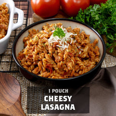 Bowl of cheesy lasagna pasta with tomato, parsley, wooden spoon, lifestyle setting, text overlay