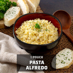 Bowl of creamy pasta alfredo with bread, parsley garnish, and '1 pouch pasta alfredo' text.