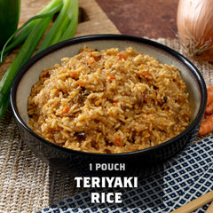 Bowl of teriyaki rice with vegetables, green onions, and pouch label, on woven mat